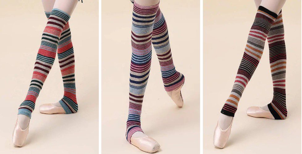 Three pairs of legs with different colored socks and shoes.