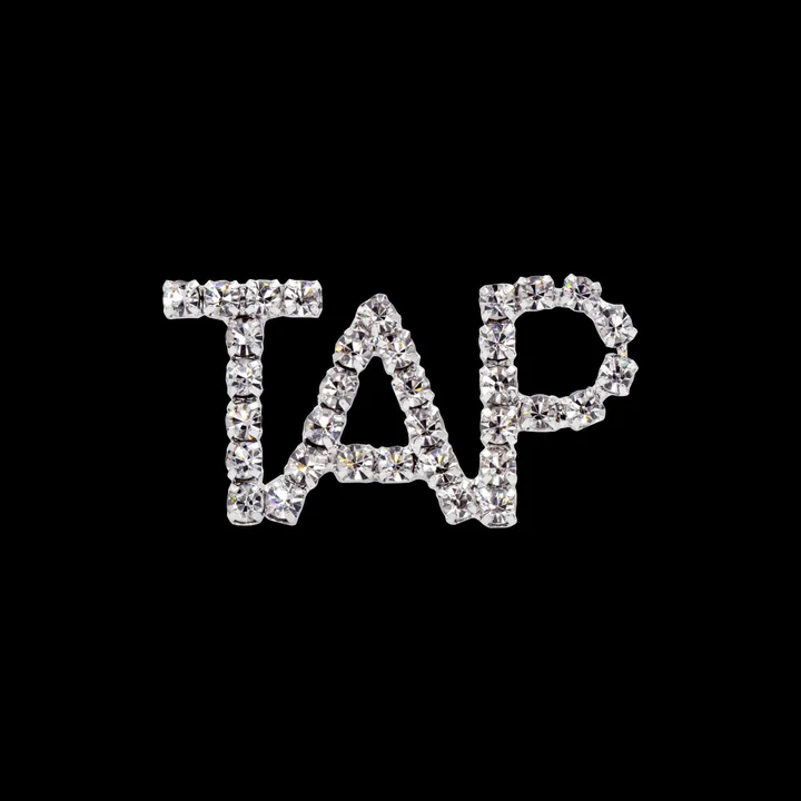 A picture of the word tap in rhinestones.