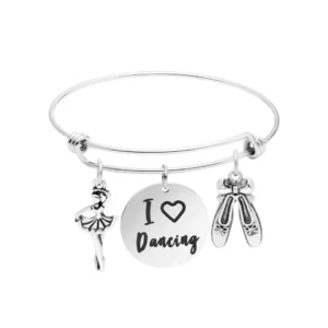 A silver bracelet with two pairs of shoes and a dancing girl.