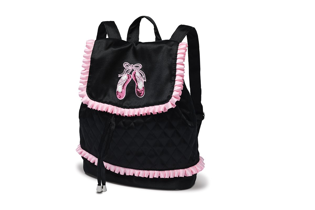 A black backpack with pink trim and a pair of ballet shoes.