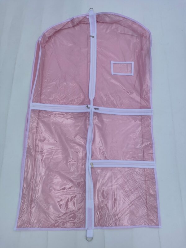 A pink garment bag with white tape around it.