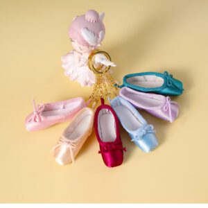 A group of different colored ballet shoes on display.