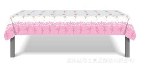 A table cloth with pink and white designs.