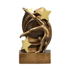 A gold statue of a person doing a handstand with stars.