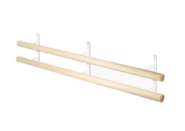 A white shelf with two wooden poles on top of it.