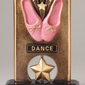 A bronze plaque with pink shoes and a star.