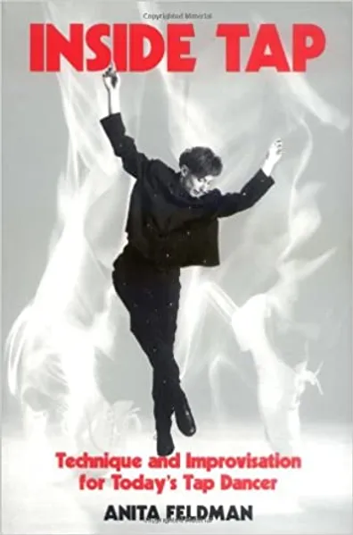 A man in black jacket jumping in air.