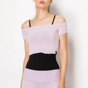 Woman wearing a stylish off-shoulder lilac top with black waist detail.