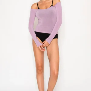Woman in a lilac off-shoulder top and black underwear posing against a white background.
