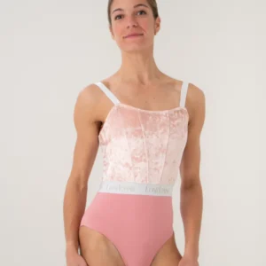 Woman wearing a pink and white ballet leotard.