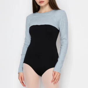 Woman wearing a stylish two-tone bodysuit with long sleeves.