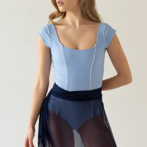 Woman in light blue leotard and sheer skirt